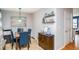 Dining area with four chairs and wooden cabinet at 145 Gentle Breeze Ct, Temple, GA 30179