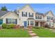 Two-story townhome with brick and siding exterior, landscaped lawn, and parking at 145 Gentle Breeze Ct, Temple, GA 30179