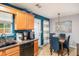 Kitchen with granite countertops, wood cabinets, and black appliances at 145 Gentle Breeze Ct, Temple, GA 30179