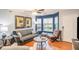 Living room features hardwood floors, bay window, and comfortable seating at 145 Gentle Breeze Ct, Temple, GA 30179