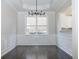 Bright dining room with chandelier and wainscoting at 338 Southgate Dr, Locust Grove, GA 30248