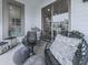 Cozy balcony with wicker chairs, side table, and sliding glass door access at 509 Burton Dr # 806, Alpharetta, GA 30009