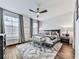 Main bedroom with hardwood floors, a king-size bed, and large windows at 509 Burton Dr # 806, Alpharetta, GA 30009