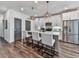 Modern kitchen with white cabinets, stainless steel appliances, and an island with seating at 509 Burton Dr # 806, Alpharetta, GA 30009