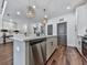 Modern kitchen with island, stainless steel appliances, and hardwood floors at 509 Burton Dr # 806, Alpharetta, GA 30009