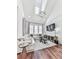 Open living area with hardwood floors, sectional sofa, and a high ceiling with a chandelier at 509 Burton Dr # 806, Alpharetta, GA 30009