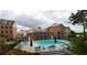 Community pool with lounge chairs and brick building at 509 Burton Dr # 806, Alpharetta, GA 30009