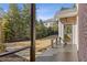 Dark stained deck and patio with yard view at 5905 Laurel Oak Dr, Suwanee, GA 30024