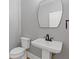 Elegant powder room with pedestal sink and modern fixtures at 5905 Laurel Oak Dr, Suwanee, GA 30024