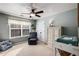 Cozy bedroom with ceiling fan and ample closet space at 6035 Bridge Fair Rd, Cumming, GA 30028