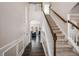 Bright and spacious entrance hall with hardwood floors and staircase at 6035 Bridge Fair Rd, Cumming, GA 30028