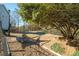 Landscaped backyard with mature trees and fenced area at 1189 Liberty Nw Pkwy, Atlanta, GA 30318