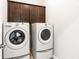 Bright laundry room with washer, dryer, and cabinets at 2381 Willington Shoals Pl # 21, Smyrna, GA 30080