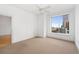 Empty bedroom with large window and neutral walls at 285 Centennial Olympic Park Nw Dr # 1407, Atlanta, GA 30313
