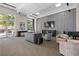 Modern community room with large TV and piano at 285 Centennial Olympic Park Nw Dr # 1407, Atlanta, GA 30313