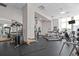 Well-equipped fitness center with cardio and weight machines at 285 Centennial Olympic Park Nw Dr # 1407, Atlanta, GA 30313