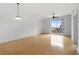 Bright living room with hardwood floors and sliding glass doors to balcony at 285 Centennial Olympic Park Nw Dr # 1407, Atlanta, GA 30313