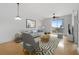 Living room with hardwood floors, stylish furniture, and balcony access at 285 Centennial Olympic Park Nw Dr # 1407, Atlanta, GA 30313