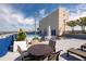 Rooftop pool with tables and chairs at 285 Centennial Olympic Park Nw Dr # 1407, Atlanta, GA 30313