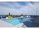 Rooftop pool with lounge chairs and planters at 285 Centennial Olympic Park Nw Dr # 1407, Atlanta, GA 30313