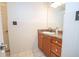 Clean bathroom with wood vanity and tile floor at 1250 Parkwood Cir # 2312, Atlanta, GA 30339