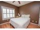 Cozy bedroom with wood floors and plantation shutters at 1250 Parkwood Cir # 2312, Atlanta, GA 30339