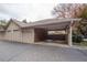 Covered carport parking for residents with brick accents at 1250 Parkwood Cir # 2312, Atlanta, GA 30339