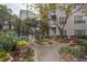 Landscaped courtyard with walking paths and benches at 1250 Parkwood Cir # 2312, Atlanta, GA 30339