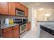 Modern kitchen with stainless steel appliances and granite countertops at 1250 Parkwood Cir # 2312, Atlanta, GA 30339