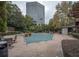 Community pool with brick patio and seating at 1250 Parkwood Cir # 2312, Atlanta, GA 30339