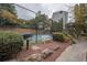 Tennis court with grill and seating area nearby at 1250 Parkwood Cir # 2312, Atlanta, GA 30339