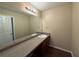 Bathroom featuring a sink with granite counters, a large mirror, and warm lighting at 308 Jarrod Oaks Ct, Loganville, GA 30052