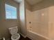 Bathroom featuring a white shower and bathtub combination with neutral paint at 308 Jarrod Oaks Ct, Loganville, GA 30052