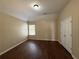 Bedroom featuring dark floors, neutral paint, a window and closet at 308 Jarrod Oaks Ct, Loganville, GA 30052