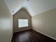 Bedroom featuring a window, neutral paint and dark wood-look floors at 308 Jarrod Oaks Ct, Loganville, GA 30052