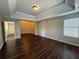 Large bedroom with tray ceilings, hardwood floors, and plenty of space at 308 Jarrod Oaks Ct, Loganville, GA 30052