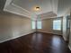 Bright bedroom featuring hardwood floors and ample natural light from large windows at 308 Jarrod Oaks Ct, Loganville, GA 30052