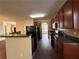 Functional kitchen with black appliances, tile backsplash and a breakfast bar at 308 Jarrod Oaks Ct, Loganville, GA 30052