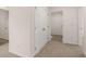 Hallway with carpet and access to bedrooms at 616 Kimberwick Dr, Locust Grove, GA 30248