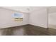 Living room features dark hardwood floors and a ceiling fan at 616 Kimberwick Dr, Locust Grove, GA 30248