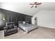 Comfortable bedroom featuring a decorative wall and a cozy armchair at 7492 Knoll Hollow Rd, Lithonia, GA 30058