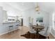 Open dining area adjacent to the kitchen, featuring modern light fixture and table at 889 City Park Se Dr, Atlanta, GA 30312