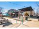 Outdoor dining area with tables, umbrellas, and multiple restaurants at 889 City Park Se Dr, Atlanta, GA 30312