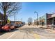 Street view of several shops and restaurants, and street parking on a sunny day at 889 City Park Se Dr, Atlanta, GA 30312