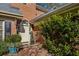 Front entry with brick accents, lush landscaping, and a welcoming walkway at 11 Ivy Chase Ne, Atlanta, GA 30342