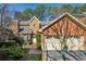 Brick front exterior of charming home with two-car garage and manicured landscaping at 11 Ivy Chase Ne, Atlanta, GA 30342