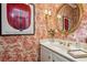 Charming powder room with toile wallpaper and a classic vanity at 11 Ivy Chase Ne, Atlanta, GA 30342