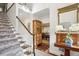 Elegant staircase with hardwood steps and neutral-toned carpeting at 11 Ivy Chase Ne, Atlanta, GA 30342