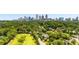 Breathtaking aerial view of Atlanta skyline behind lush greenery, golf course and gorgeous Ansley Park homes at 1445 Monroe Ne Dr # B7, Atlanta, GA 30324