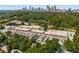 Aerial shot of Ansley Park's commercial district, nestled among mature trees, homes, and the Atlanta skyline at 1445 Monroe Ne Dr # B7, Atlanta, GA 30324